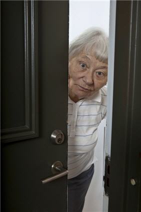 elderly woman opening door